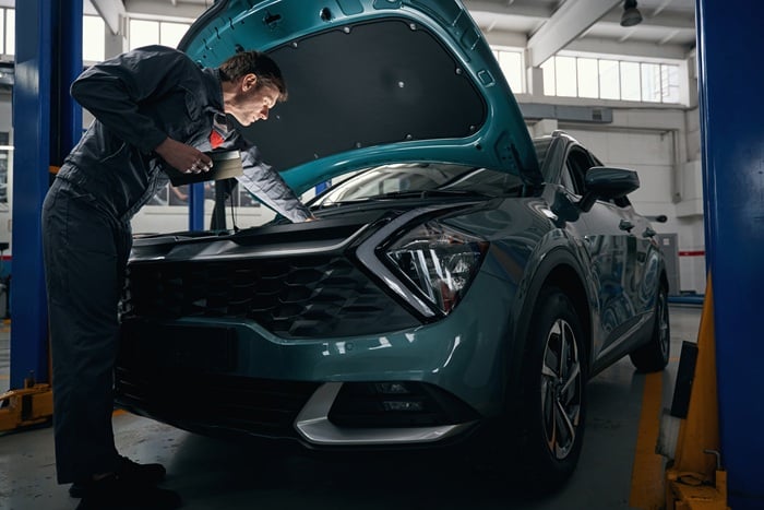 Mechanic Inspecting Kia - Kia lemon law lawyer san diego